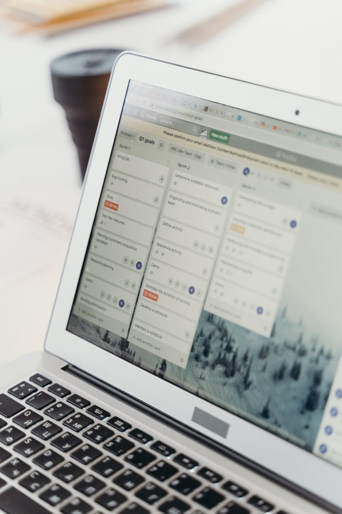 services-03 Close-up of a laptop screen showing project management software interface. Perfect for business or tech themes.